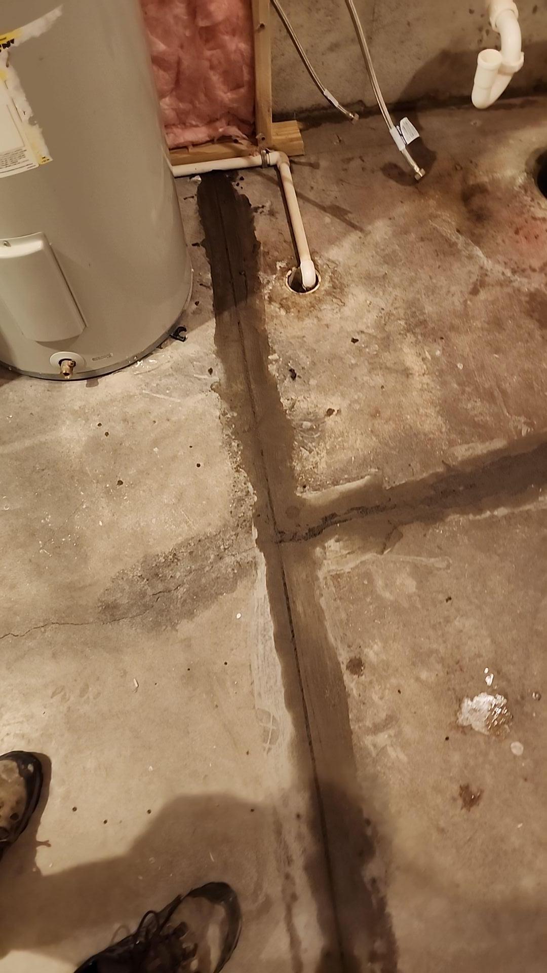 Expert technician performing crack repair on a residential wall in White Cloud, Michigan