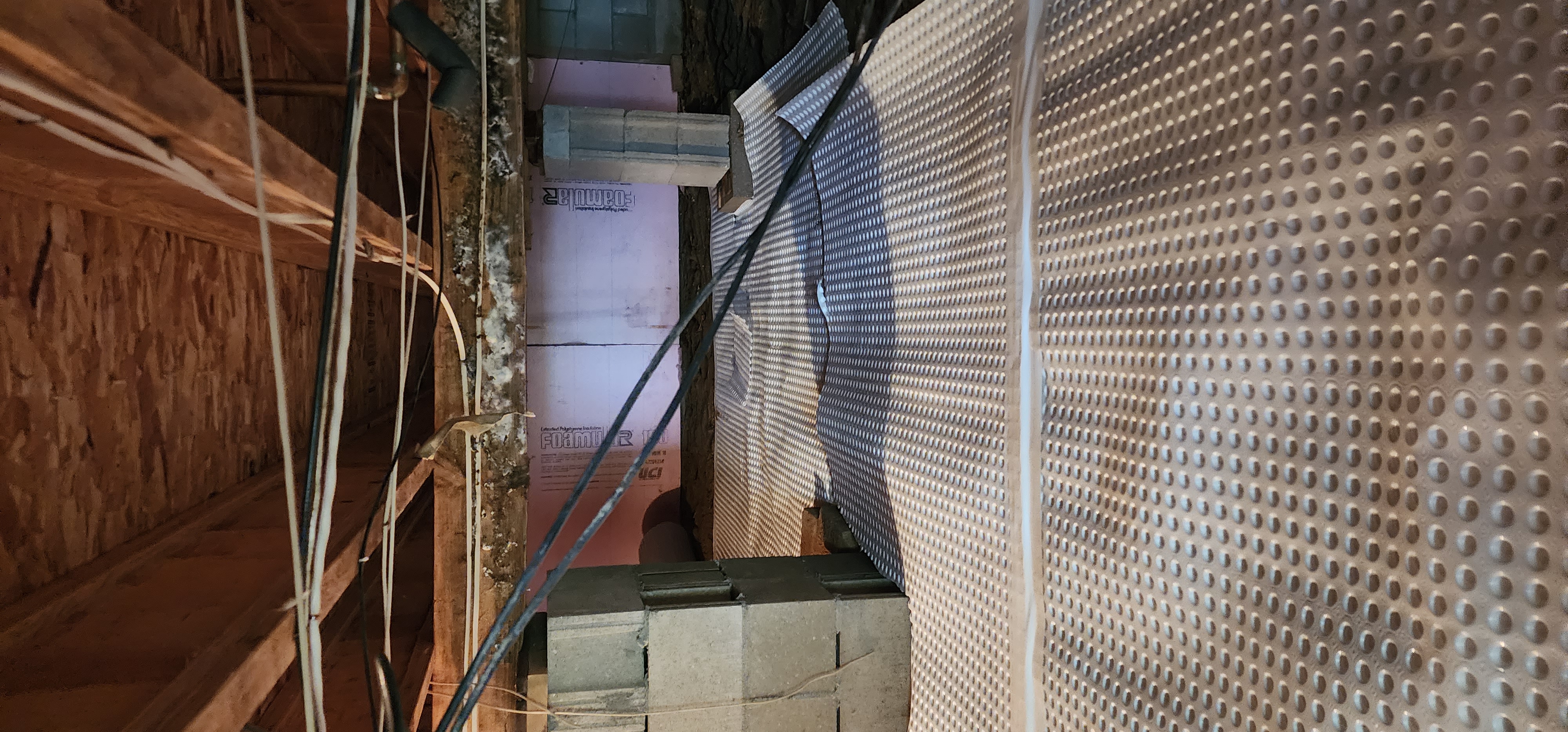 Crawlspace encapsulation process demonstrating sealing and protection techniques for homes.